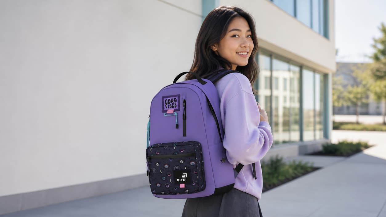 European-style structured school backpack worn by a teen student in a modern school setting