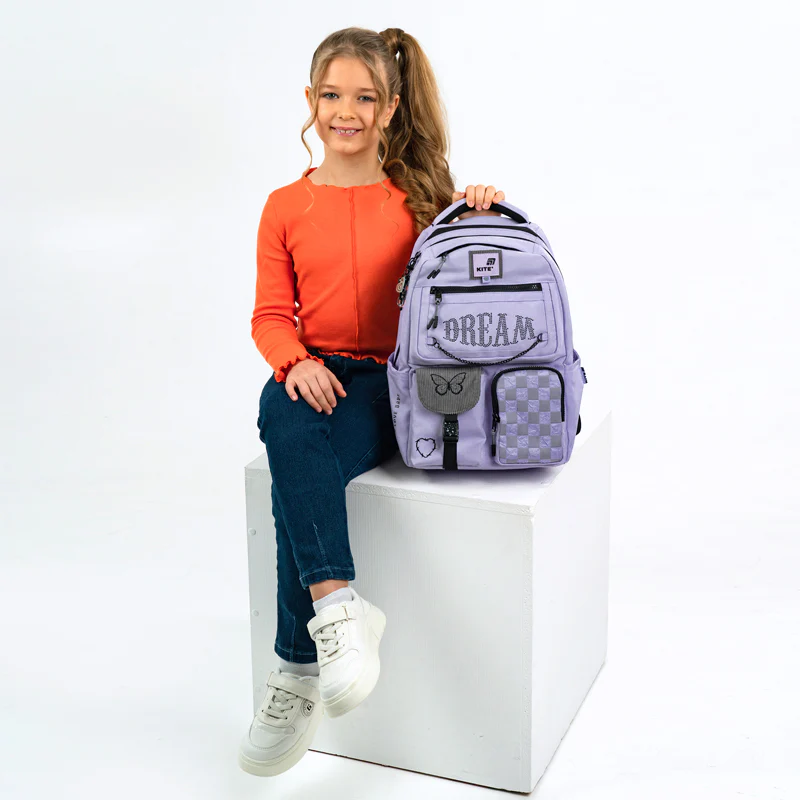 Girl wearing Kite backpack